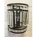 A set of nine Cotterell & Co antique style bronze colour wall lights, the crescent shaped bars