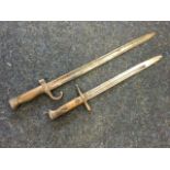 A 20in antique bayonet with channelled blade and hardwood handle; and another 16in similar. (2)