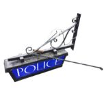 An wrought iron police sign from Wooler Police Station, the rectangular illuminated cabinet with
