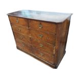 A Victorian mahogany chest of drawers with rectangular rounded top above two short and three long