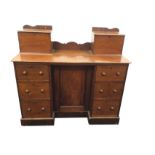 A ninteenth century mahogany kneehole dressing table, with pedestal drawers framning panelled