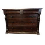 A Victorian mahogany chest of drawers with cushion moulded frieze drawer above three long
