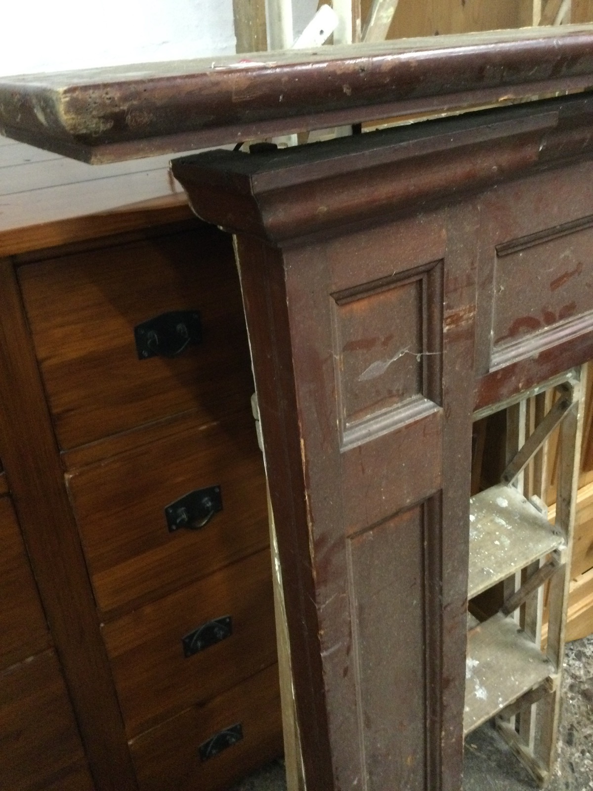 A stained chimneypiece with moulded mantelpiece above a panelled frame, the jambs on moulded plinth. - Image 2 of 3