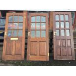 Three glazed hardwood doors, each with nine panes and fielded panels, all mounted with brass 5-lever