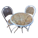 A circular painted garden table with two folding chairs, with mesh panels on tubular frames. (3)