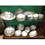 An extensive Victoria China dinner/tea set decorated with scrolled friezes framing fruit