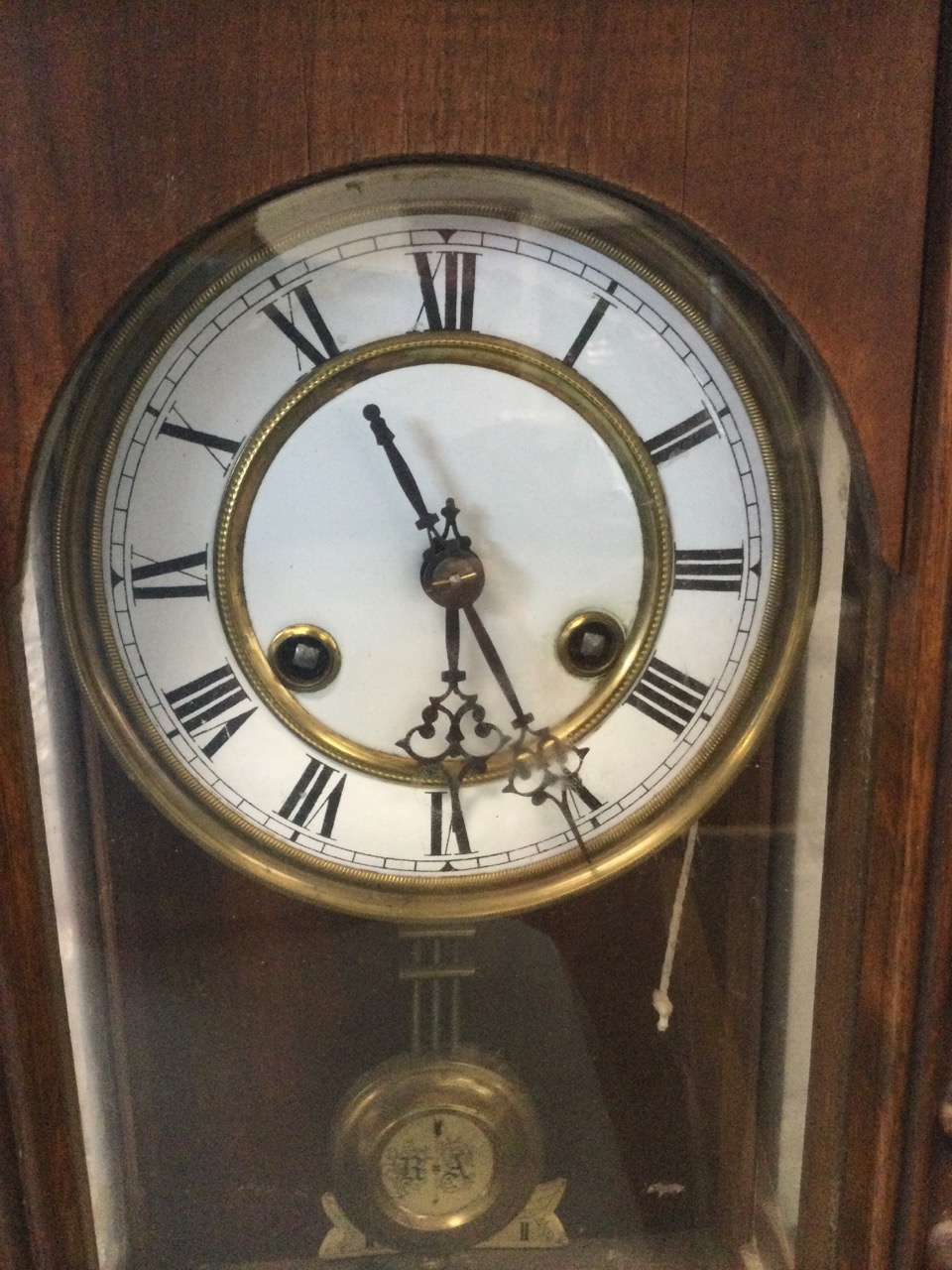 A late Victorian walnut cased Vienna wallclock, with moulded cornice above an arched door flanked by - Image 2 of 3