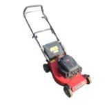 A Champion petrol driven lawn scarifier - model 40, with 45cm rotate.