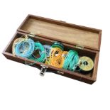A rectangular wood box containing five fly lines, nylon spools, backing, a Farlow fly tying vice,