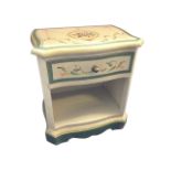 A floral painted side cabinet, the serpentine shaped moulded top above a frieze drawer, having