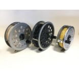 Two Shakespeare Beaulite 4.5in salmon fly reels - one unused; and a Ryobi 3.5in trout reel with