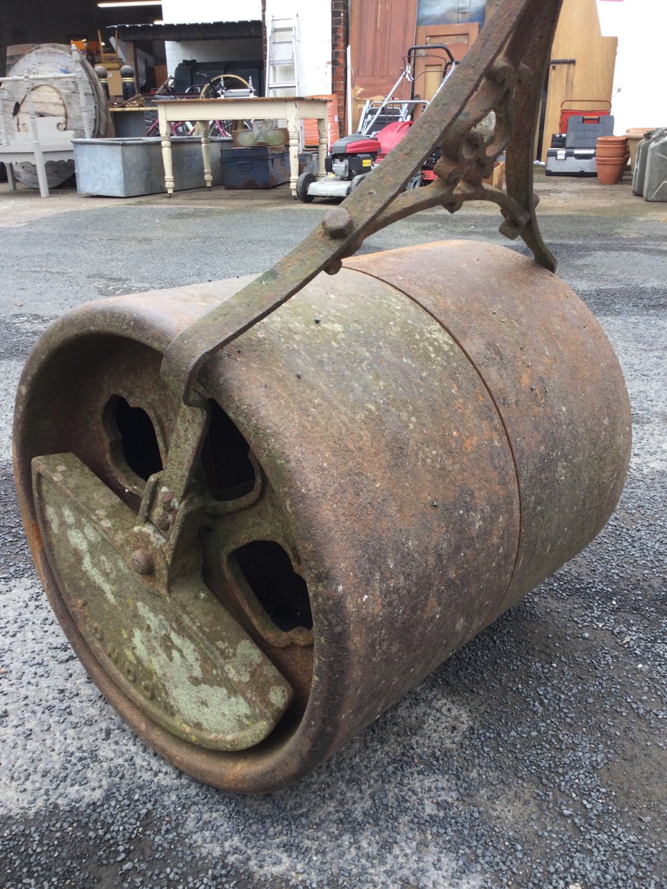 A Victorian cast iron roller with weighted twin drum, having decorative iron handle. (53in) - Image 3 of 3