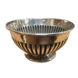 A circular hallmarked silver bowl with rolled rim & fluted body - Chester 1912, 122 gms. (4.5in)