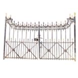 A pair of Victorian cast iron 'country house' gates with spear finials to iron spindles, the top