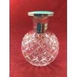 A Victorian hallmarked silver mounted scent bottle, the hinged cover with guilloche enamelling
