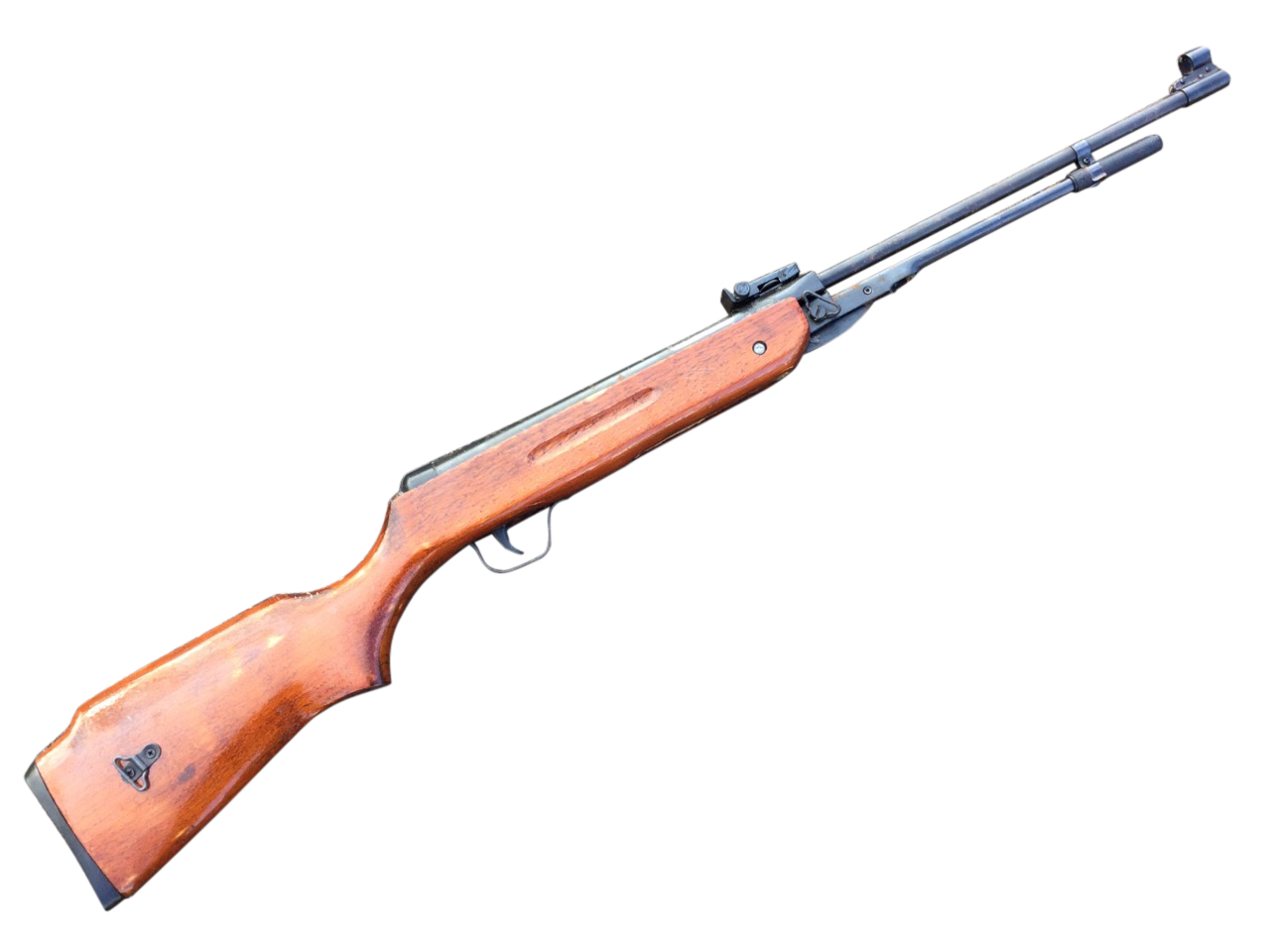 An unmarked .22 air rifle, with lever action and beech stock. (41in)