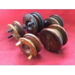 Five antique Nottingham/Scarborough type hardwood reels with brass mounts - unmarked. (5)