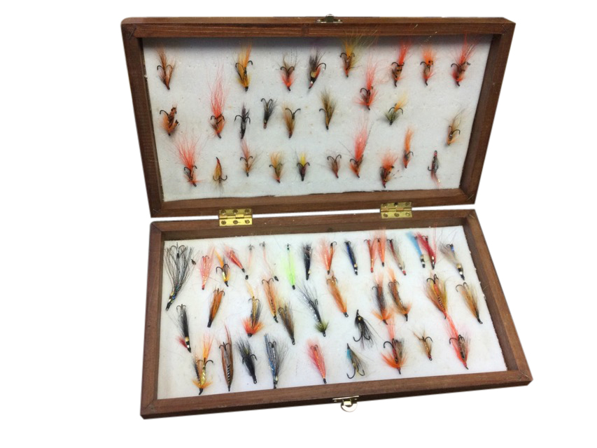 A contemporary wood fly box containing over 60 modern salmon flies.