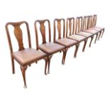 A set of eight mahogany dining chairs with Queen Anne style backs above drop-in upholstered seats,