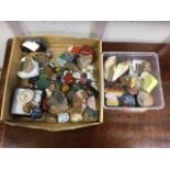 A collection of geological specimens including rose quartz, amethyst, fluorspar, polished stones,