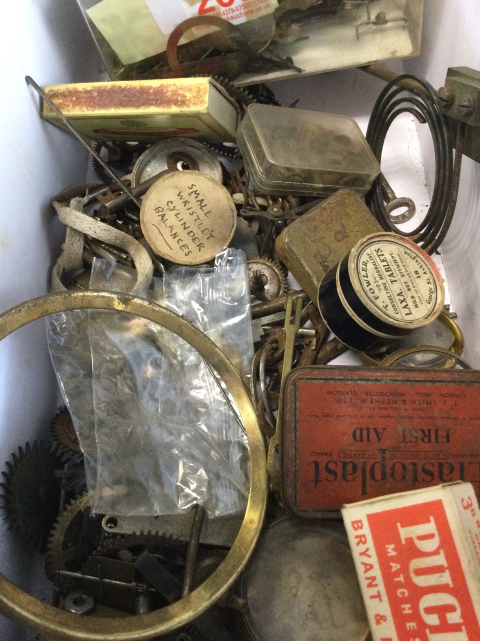 The contents of a watchmakers workshop including springs, movements, keys, parts, dials, fine - Image 2 of 3