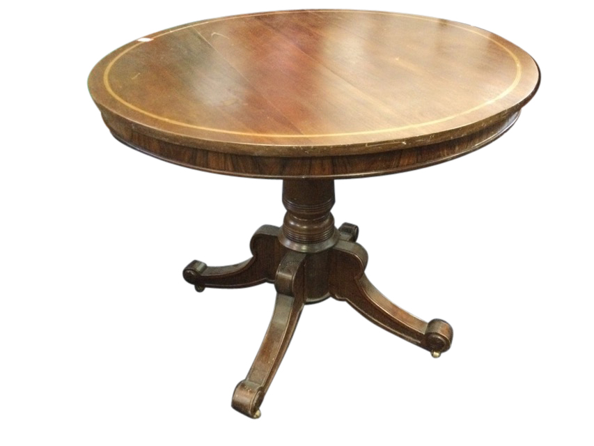 A mahogany drum table, the circular top inlaid with boxwood & ebony stringing above a plain apron,