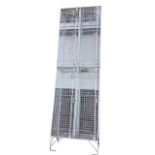 A cage type locker with four rectangular hinged doors having internal hooks. (24in x 12.25in x