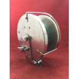 A large 6in Alcock sea fishing reel with steel drum and chrome mounts.
