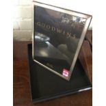 A boxed Goodwins hallmarked silver photo frame. (10in x 8in)