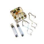 A pair of Hardy car rod clips; a Snowbee fly box full of trout flies/lures; and a pair of Hardy