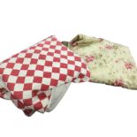 A red & white patchwork quilt sewn in a diamond pattern - 90in x 80in; and another quilt in floral