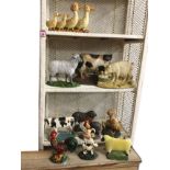 A collection of painted cast iron farmyard animal flatback doorstops - pigs, sheep, cows, ducks &