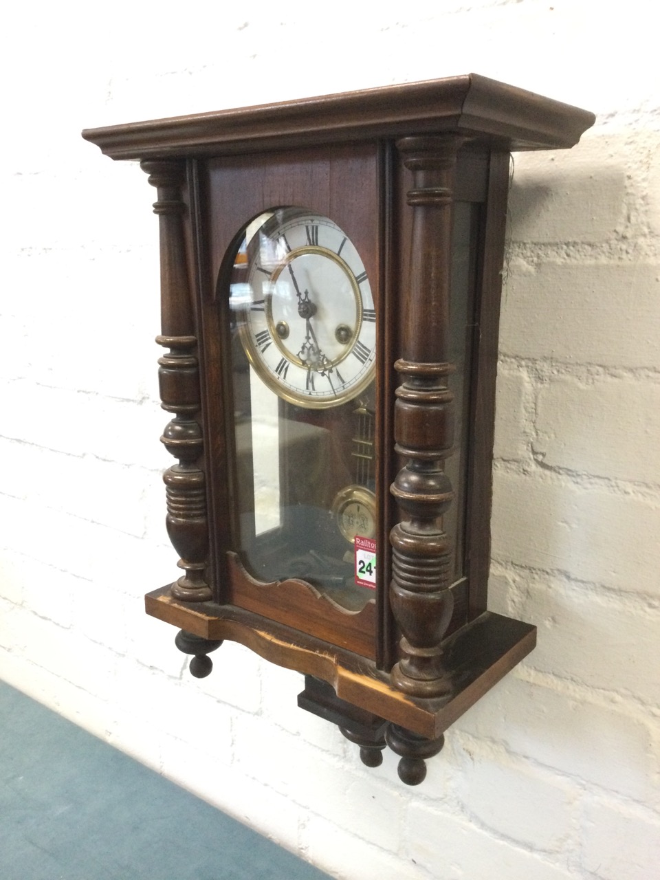 A late Victorian walnut cased Vienna wallclock, with moulded cornice above an arched door flanked by - Image 3 of 3