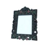 A carved and painted hardwood mirror, the rectangular plate in pierced leaf & floral carved scrolled