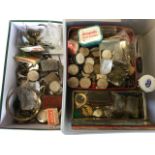 The contents of a watchmakers workshop including springs, movements, keys, parts, dials, fine