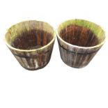 A pair of pine garden tubs of tapering barrel form, the staves each mounted with two metal strap