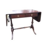 A reproduction mahogany sofa table, the top with rounded drop-leaves above two frieze drawers,