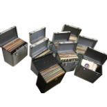 A vinyl record collection contained in eight aluminium cases, mainly light music, Elvis, pop,