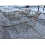 A set of six oval wirework baskets, the frames having hand-holes to ends. (23in x 16.5in x 8in) (6)