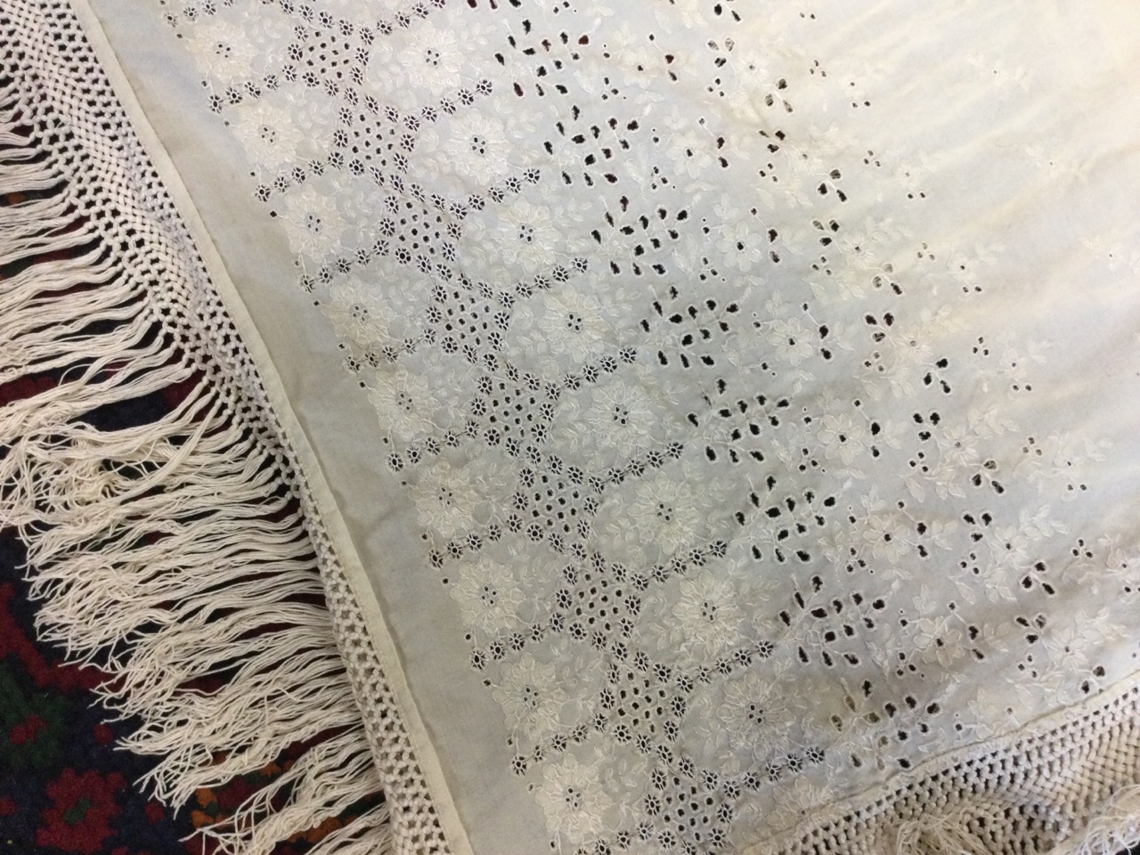 A Victorian cotton shawl embroidered with openwork flowers, having border with crocheted plaited - Image 2 of 3