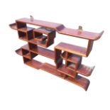 A Chinese wenge rosewood huanghuali wallshelf with carved stylised and shaped platforms. (25in x