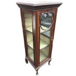 A late Victorian mahogany glazed display cabinet, the moulded top with dentil band above a glass