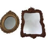 An oval nineteenth century mirror in fine floral leaf moulded gilt & gesso frame; and a