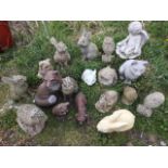 A collection of 15 composition garden ornaments - owls, rabbits, foxes, a cat, a frog, etc; and a