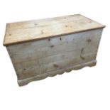 A Victorian dovetailed pine blanket box having interior with candlebox, raised on shaped apron. (