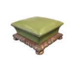 A carved Victorian mahogany footstool with leather upholstery, the waisted cushion above a gadrooned