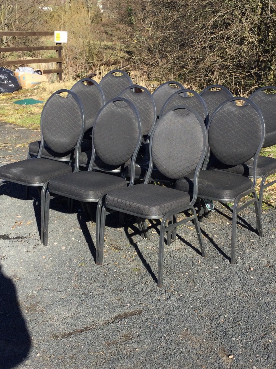 A set of eleven stacking chairs with oval padded backs and cushion seats, raised on square angled - Image 2 of 3