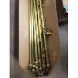 39 brass stair rods with fluted acorn style terminals, complete with hinged angled brass fixings. (