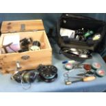 A fishing bag containing a quantity of fishing tackle including six trout fly reels with lines,