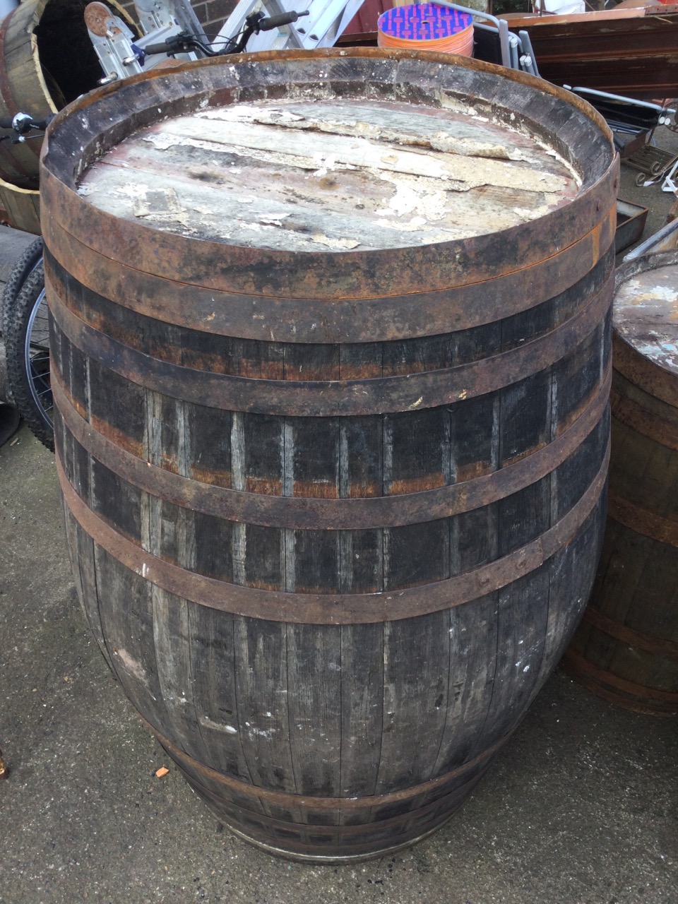 A large oak whiskey barrel, the staves bound by ten riveted metal strap bands. (51in) - Image 2 of 3